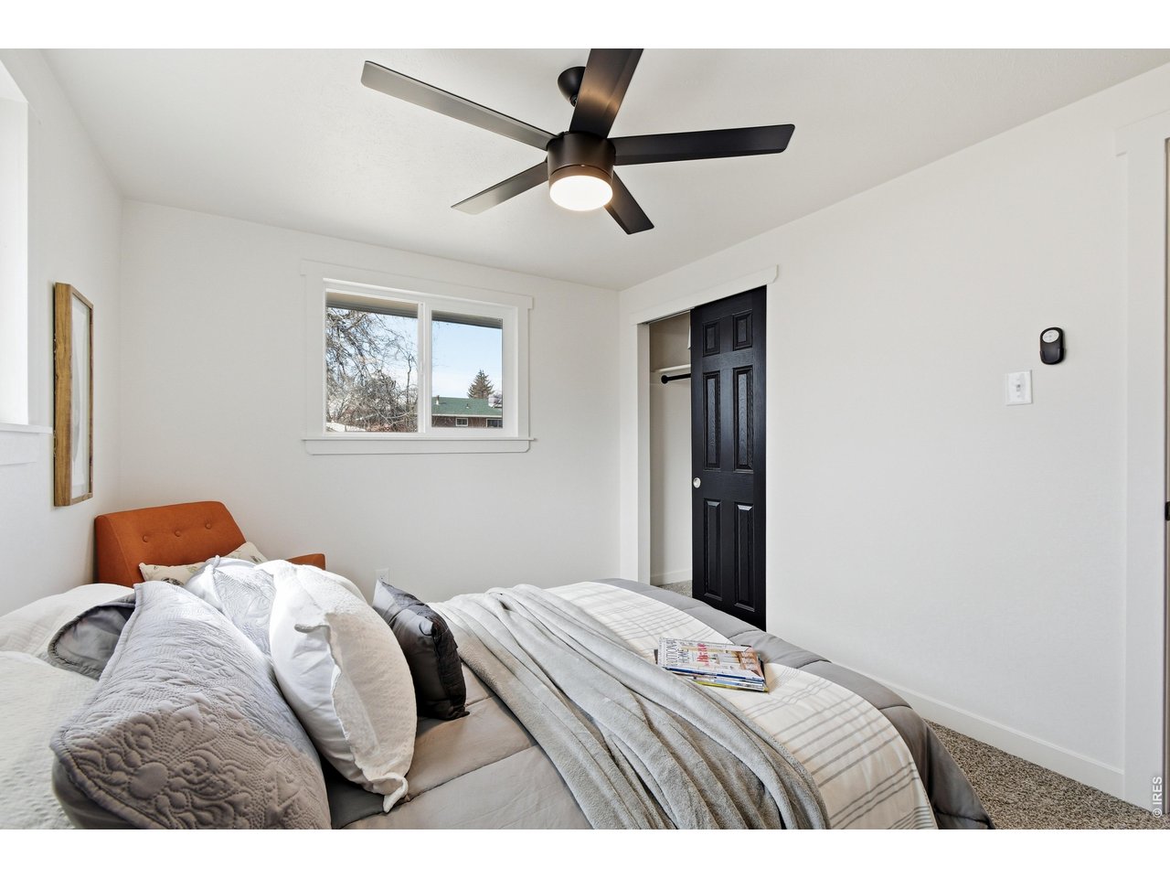 1239 Sunset Street Longmont, CO 80501 - Photo 23 of 34 a bedroom with bed and a window