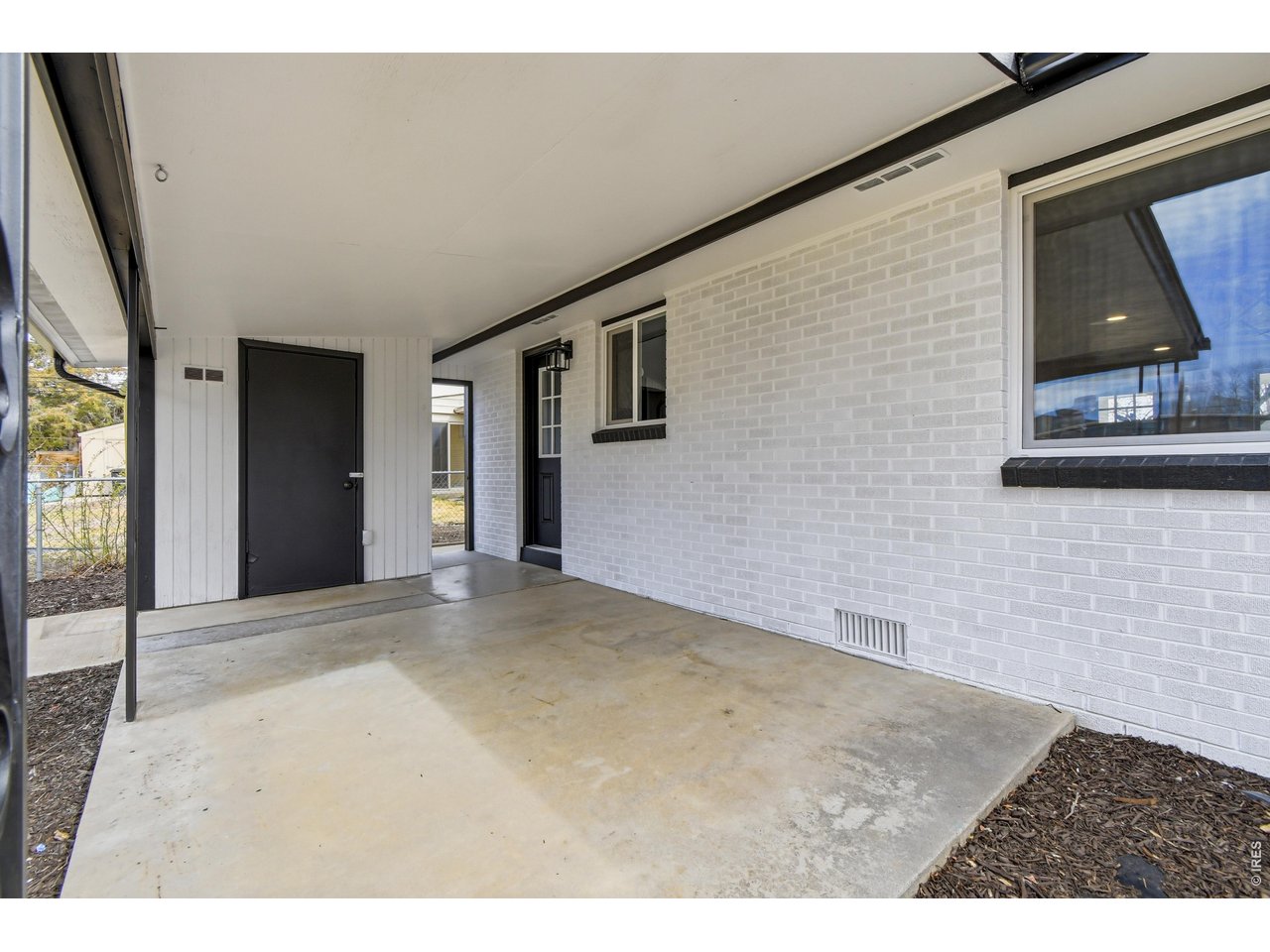 1239 Sunset Street Longmont, CO 80501 - Photo 31 of 34 a view of an empty room with a window
