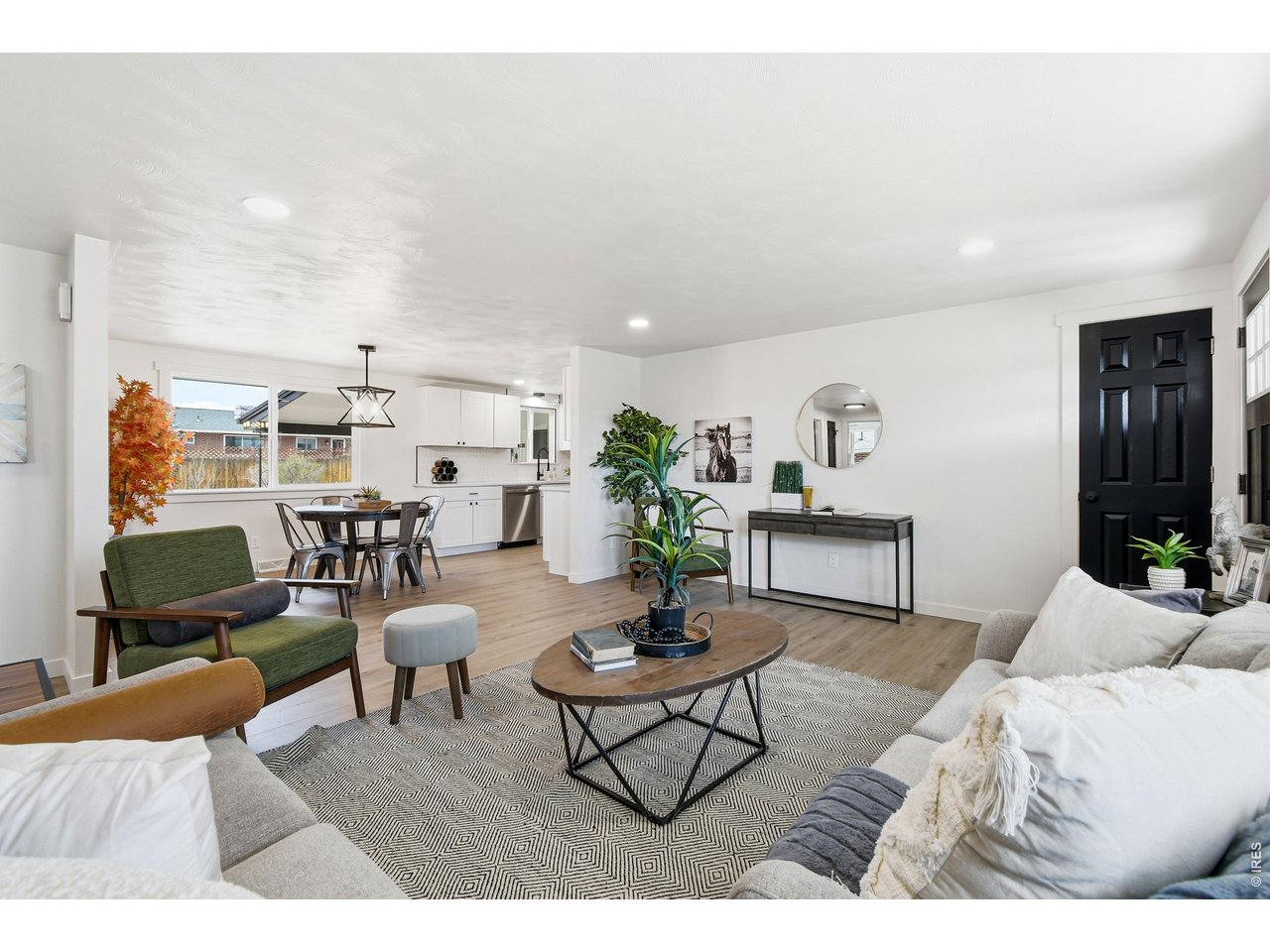 1239 Sunset Street Longmont, CO 80501 - Photo 7 of 34 a living room with furniture and wooden floor