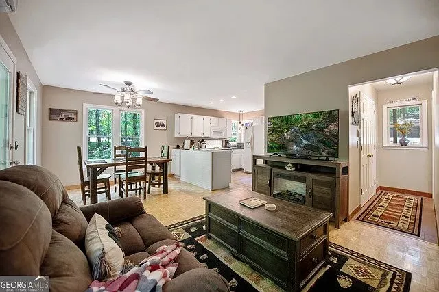 a living room with furniture and a flat screen tv