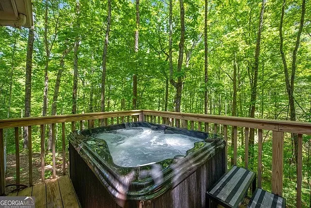a view of balcony with wooden floor and outdoor seating