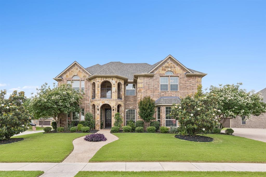 2701 Brunswick Cove Trophy Club, TX 76262 - Photo 1 of 40 a front view of a house with a yard