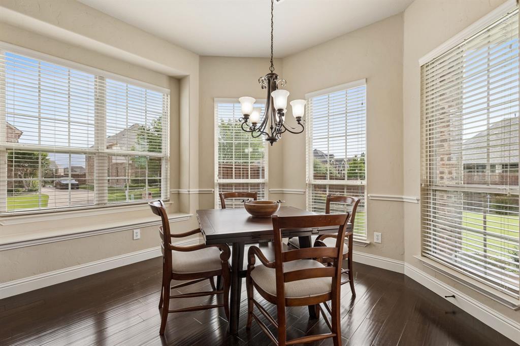 2701 Brunswick Cove Trophy Club, TX 76262 - Photo 18 of 40 a dining room with furniture large windows and wooden floor