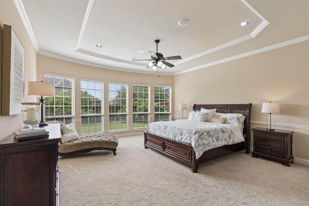 2701 Brunswick Cove Trophy Club, TX 76262 - Photo 20 of 40 a spacious bedroom with a bed and a couch