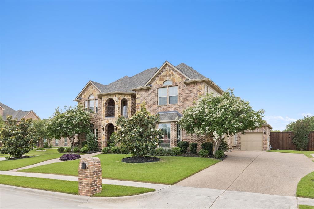 2701 Brunswick Cove Trophy Club, TX 76262 - Photo 2 of 40 a front view of a house with a yard