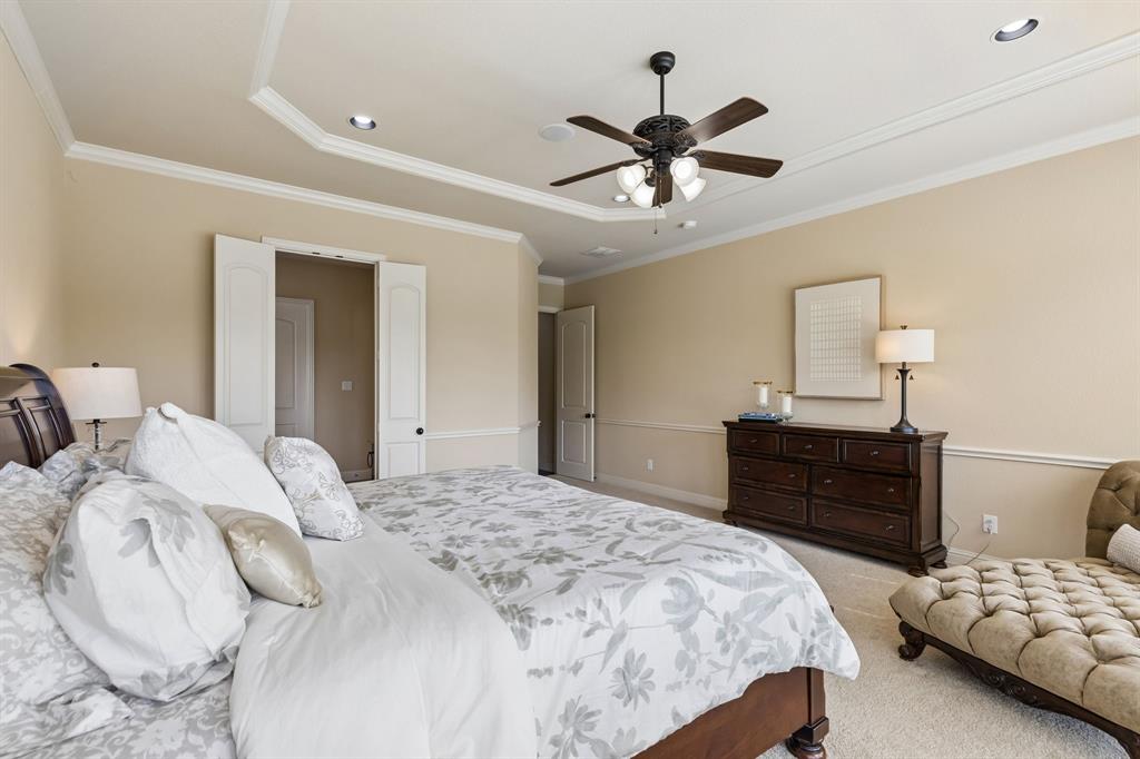 2701 Brunswick Cove Trophy Club, TX 76262 - Photo 22 of 40 a bedroom with a bed and wooden floor