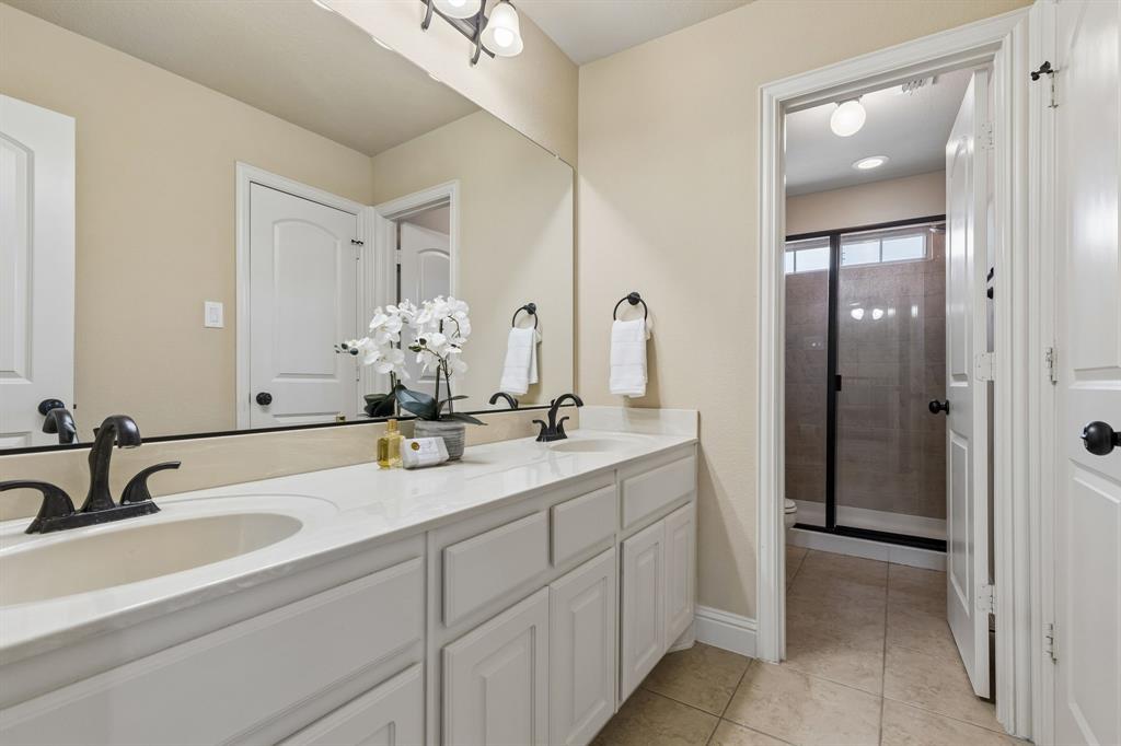 2701 Brunswick Cove Trophy Club, TX 76262 - Photo 28 of 40 a bathroom with double sink and a mirror