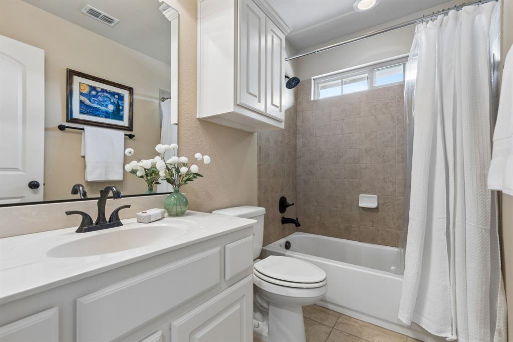 2701 Brunswick Cove Trophy Club, TX 76262 - Photo 30 of 40 a bathroom with a sink a toilet and shower