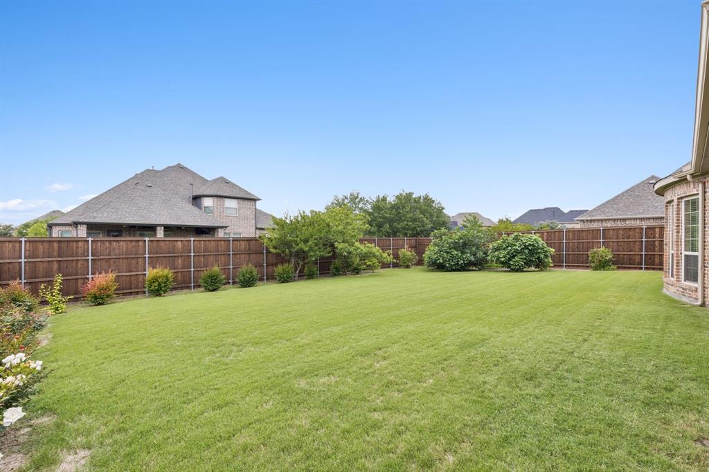 2701 Brunswick Cove Trophy Club, TX 76262 - Photo 37 of 40 a view of a large garden with plants and large trees