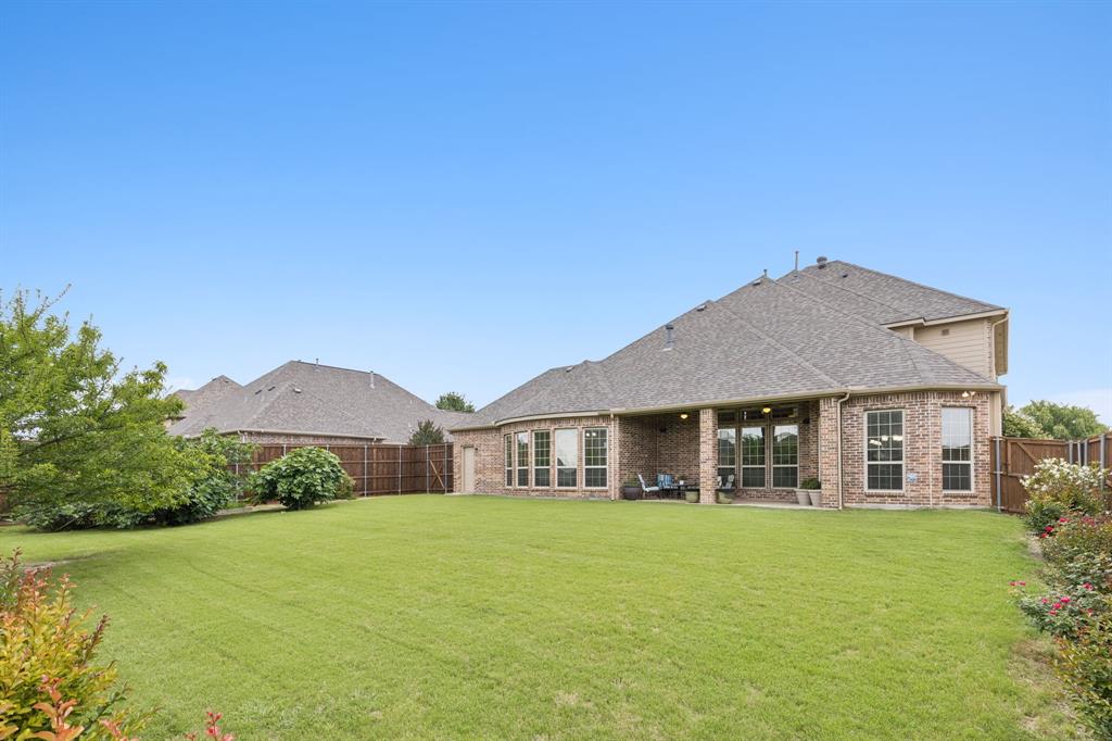 2701 Brunswick Cove Trophy Club, TX 76262 - Photo 38 of 40 a front view of a house with a garden