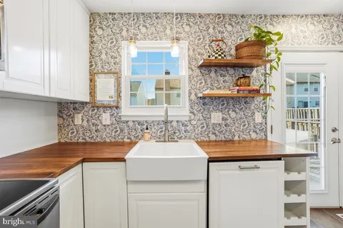 a kitchen that has a sink and a stove
