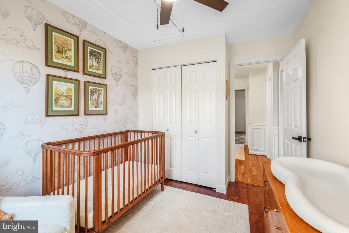 5712 Richardson Mews Square Halethorpe, MD 21227 - Photo 16 of 29 a view of a bedroom with furniture and staircase