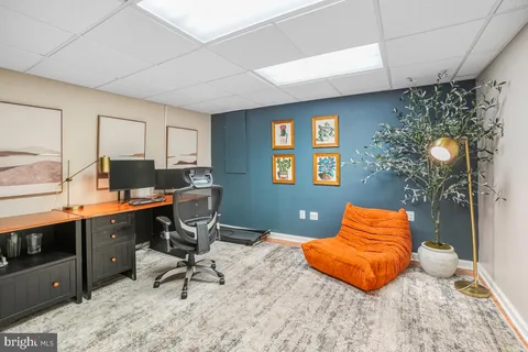 a bedroom with a bed and a table in it