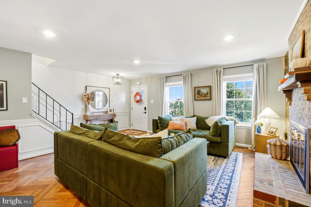 5712 Richardson Mews Square Halethorpe, MD 21227 - Photo 6 of 29 a living room with furniture fireplace and a large window