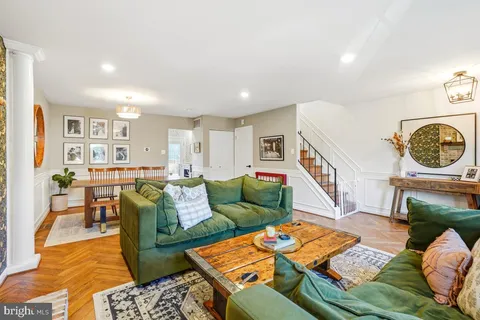 a living room with furniture and a table