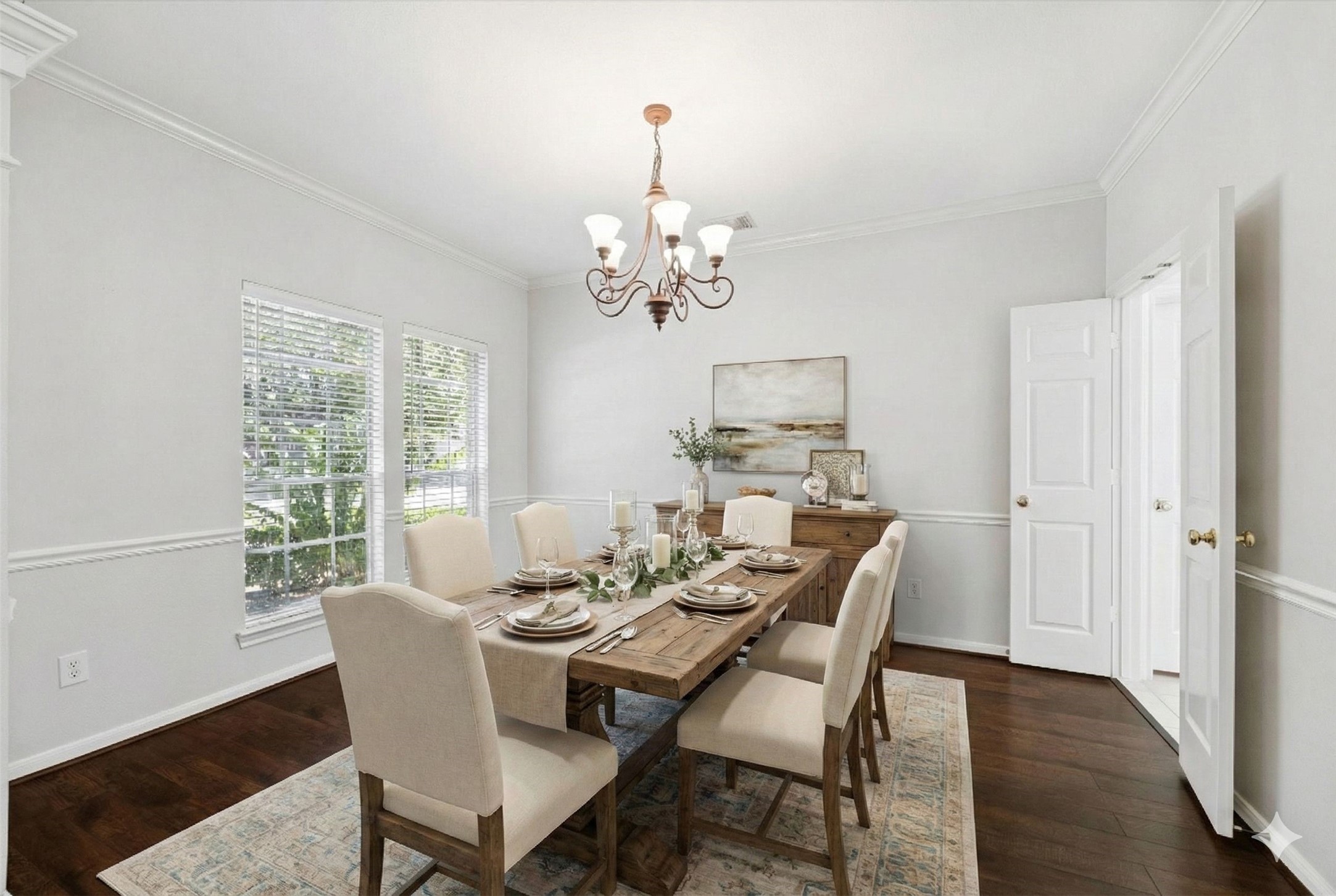 12019 Costa Del Rey Court Houston, TX 77041 - Photo 3 of 32 a view of a dining room with furniture a chandelier and wooden floor