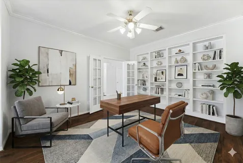 a living room with furniture and a potted plant