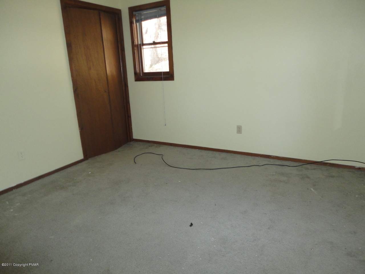211 Decker Road Bushkill, PA 18324 - Photo 4 of 5 an empty room with windows