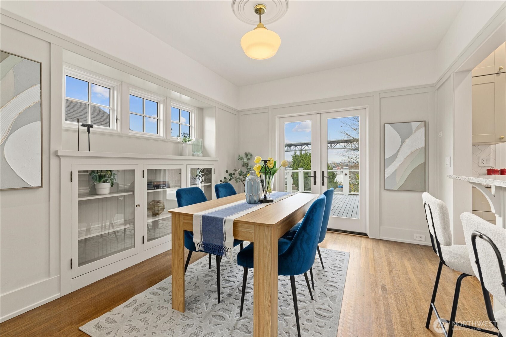2912 3rd Avenue North Seattle, WA 98109 - Photo 11 of 37 a view of a dining room with furniture and wooden floor