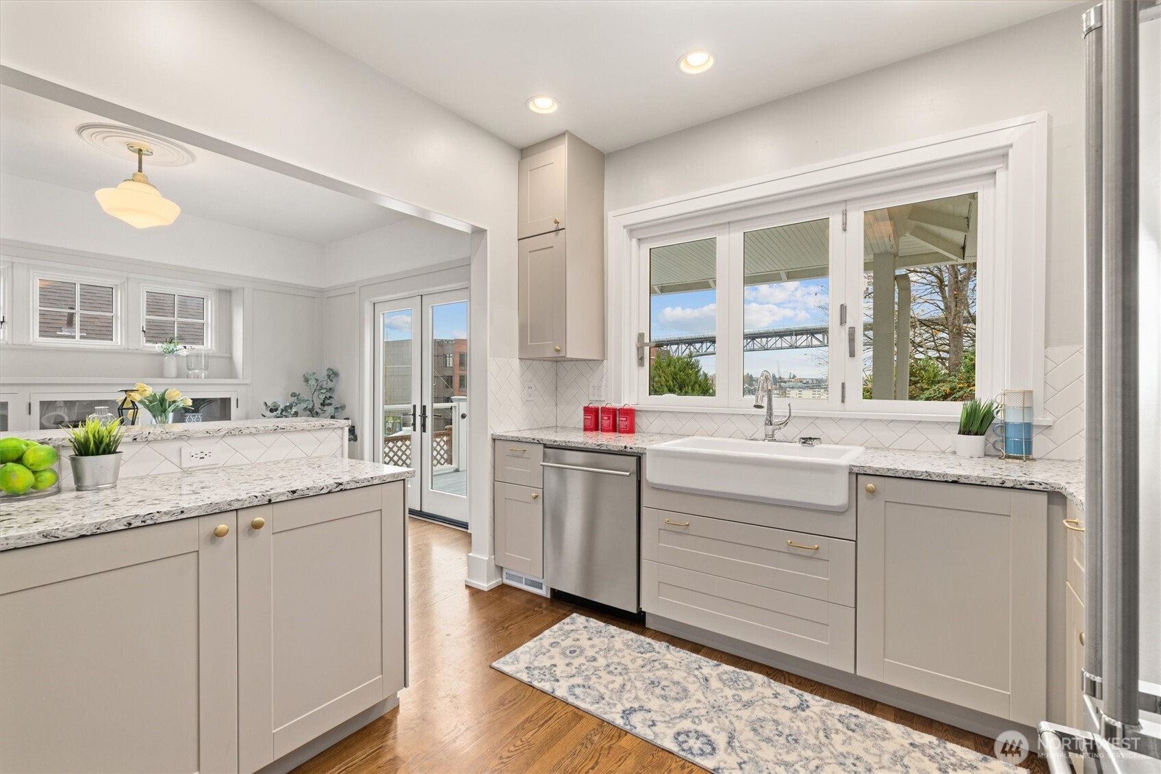 2912 3rd Avenue North Seattle, WA 98109 - Photo 17 of 37 a kitchen with a sink window and cabinets