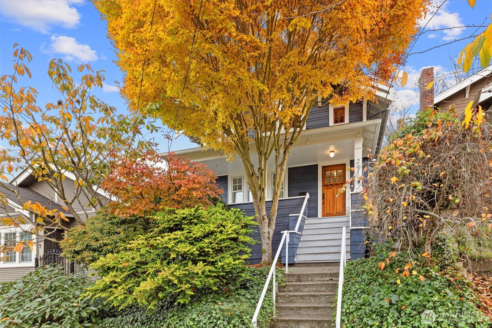 2912 3rd Avenue North Seattle, WA 98109 - Photo 2 of 37 a front view of a house with a tree