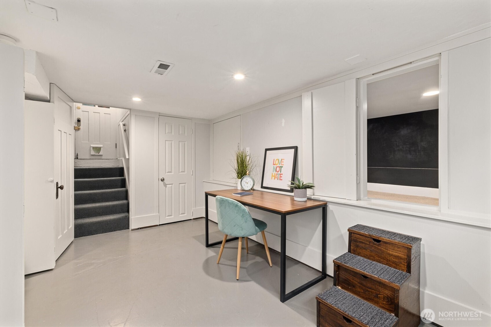 2912 3rd Avenue North Seattle, WA 98109 - Photo 21 of 37 a view of a workspace with furniture and cabinet