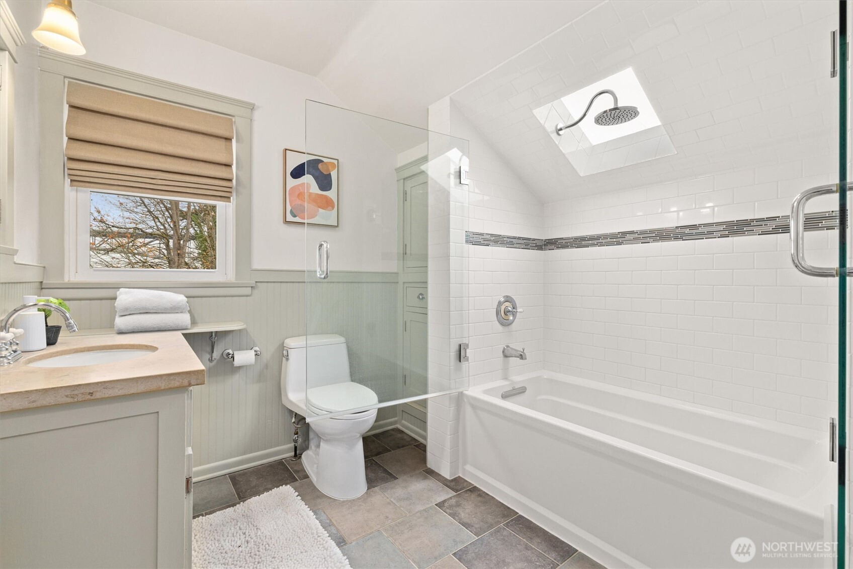 2912 3rd Avenue North Seattle, WA 98109 - Photo 26 of 37 a bathroom with a sink a toilet and a bathtub
