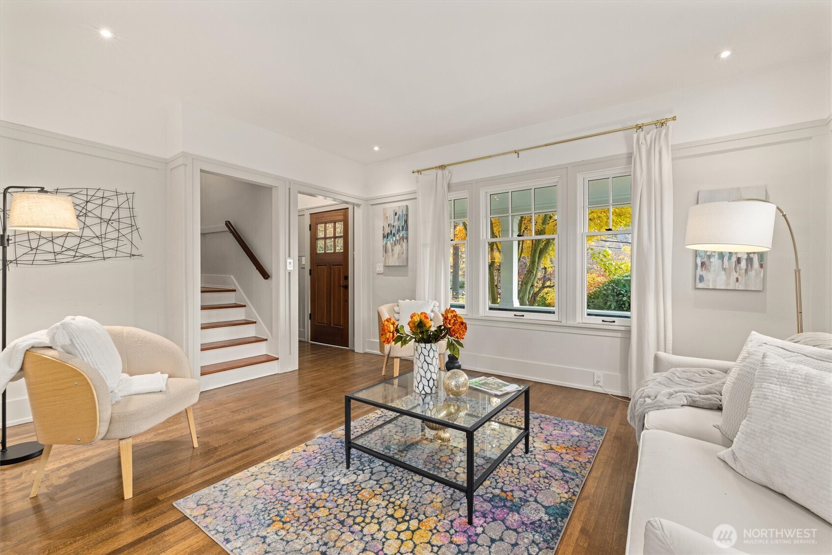 2912 3rd Avenue North Seattle, WA 98109 - Photo 8 of 37 a living room with furniture and a large window
