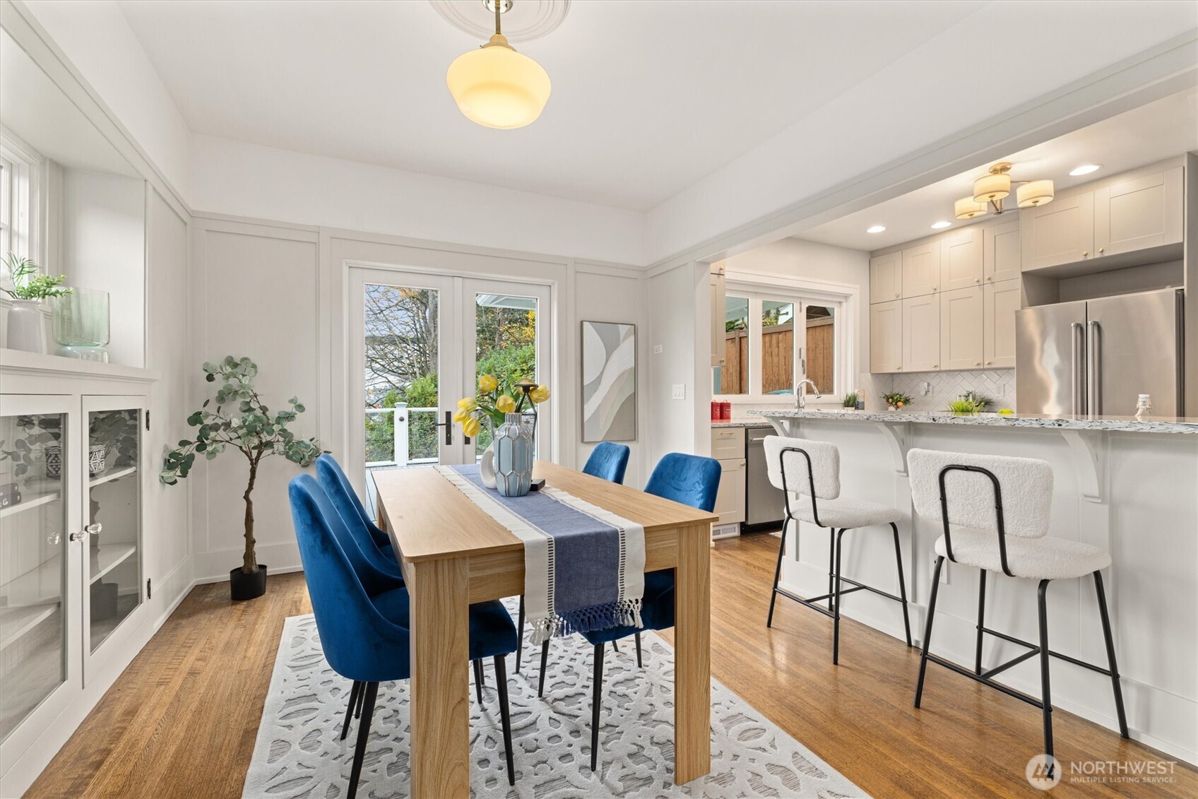 2912 3rd Avenue North Seattle, WA 98109 - Photo 10 of 37 a view of a dining room with furniture and wooden floor