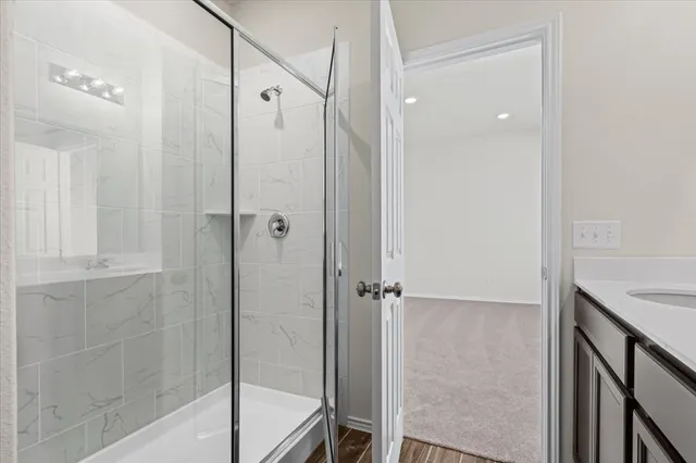 a bathroom with a shower and a tub