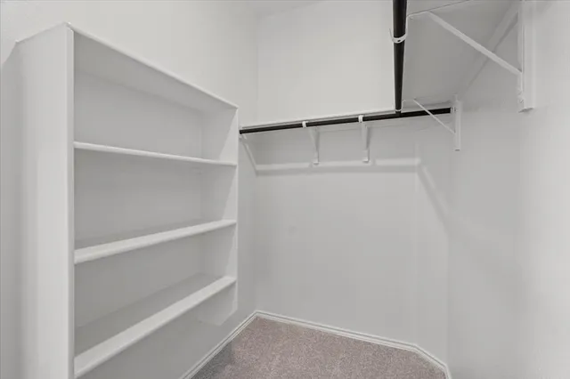 a view of an empty walk in closet