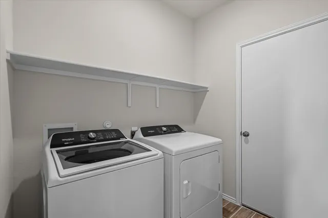 a utility room with dryer and washer