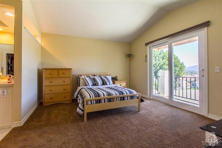 818 Congressional Road Simi Valley, CA 93065 - Photo 22 of 33 a bedroom with a bed and a window