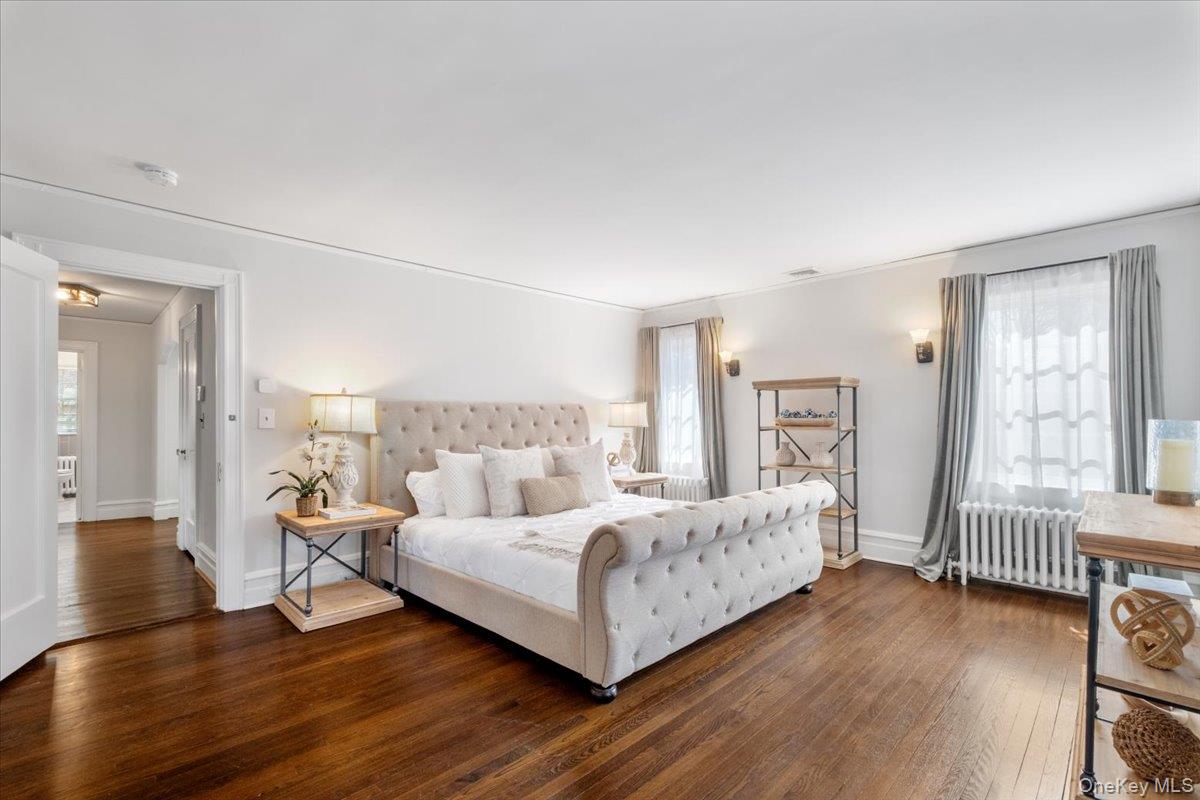 9 Lockwood Road Scarsdale, NY 10583 - Photo 12 of 33 a bedroom with a bed and a large window