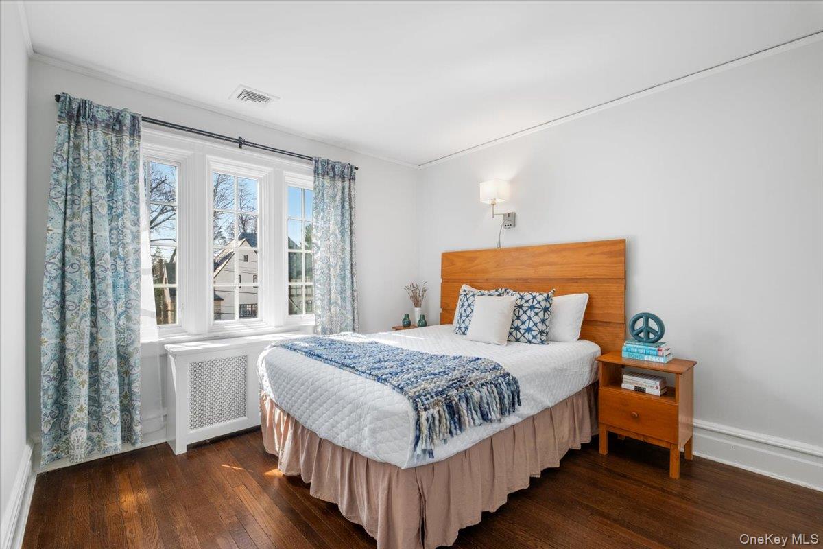 9 Lockwood Road Scarsdale, NY 10583 - Photo 16 of 33 a bedroom with a bed and a window