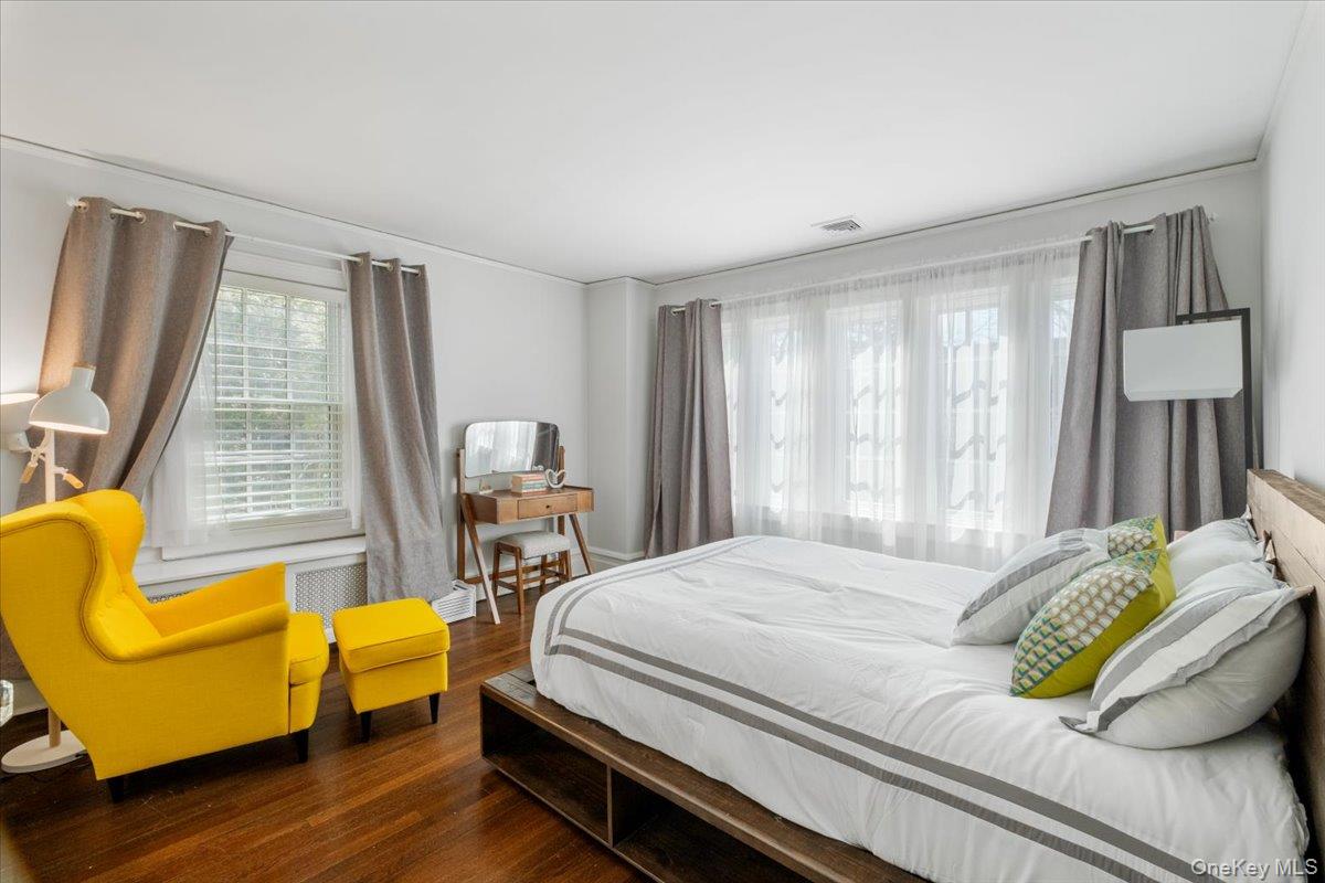 9 Lockwood Road Scarsdale, NY 10583 - Photo 17 of 33 a bedroom with a bed and a couch next to a window