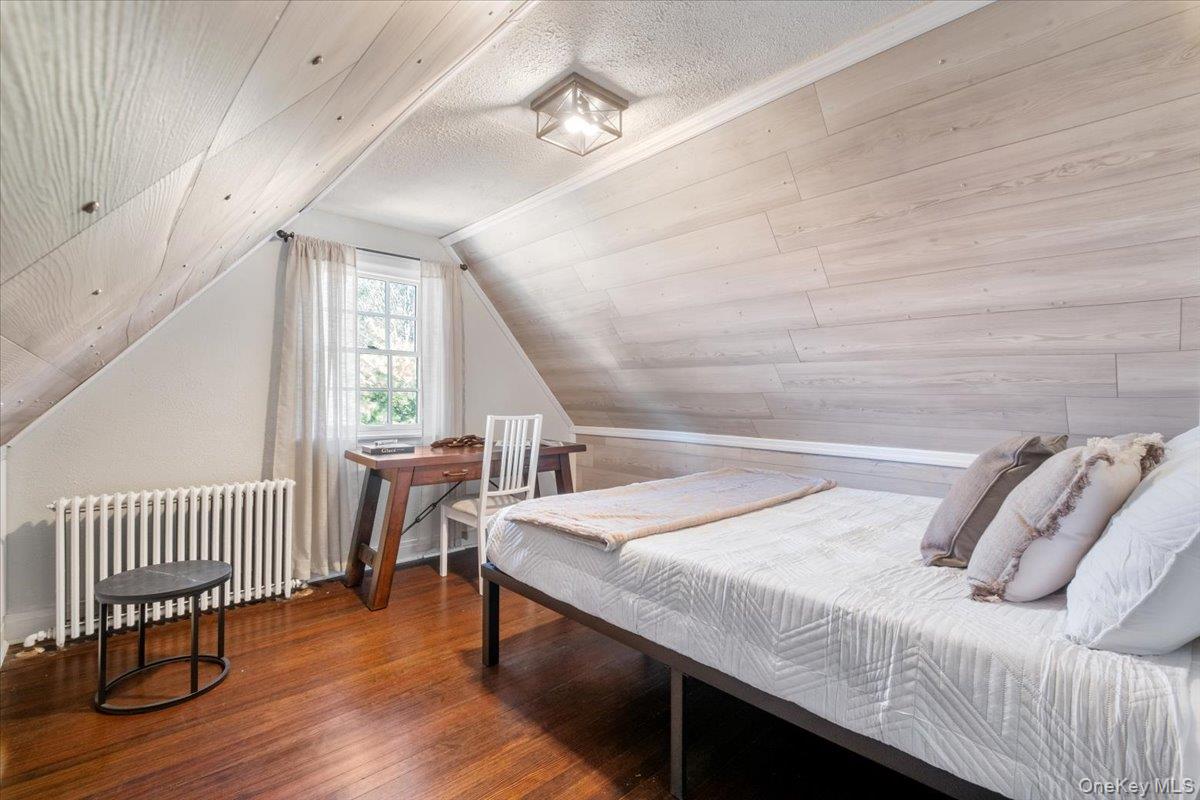 9 Lockwood Road Scarsdale, NY 10583 - Photo 20 of 33 a bedroom with a bed and a window