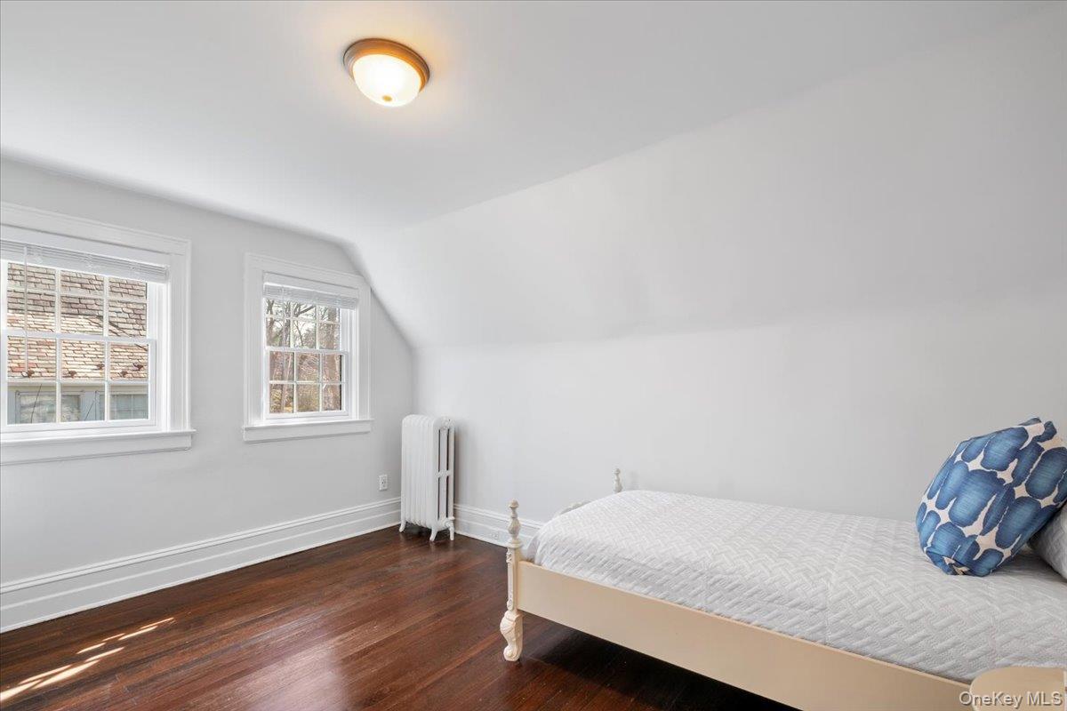 9 Lockwood Road Scarsdale, NY 10583 - Photo 22 of 33 a bedroom with a bed and a window