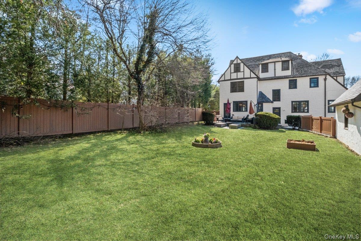 9 Lockwood Road Scarsdale, NY 10583 - Photo 24 of 33 a view of a big yard with plants and large tree