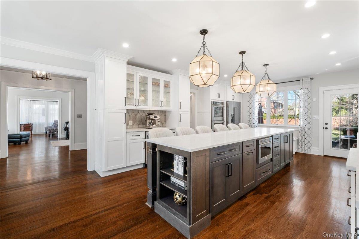 9 Lockwood Road Scarsdale, NY 10583 - Photo 3 of 33 a kitchen with a sink and wooden floor