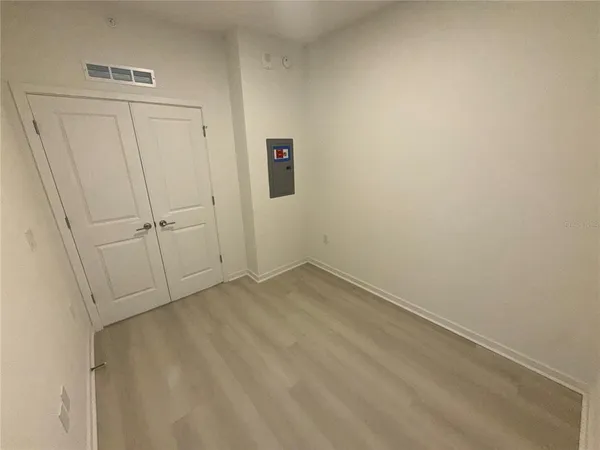 a view of a kitchen with a sink and a refrigerator