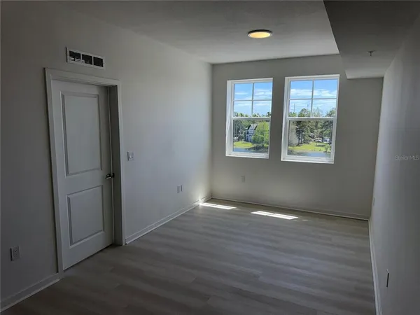a view of an empty room and window