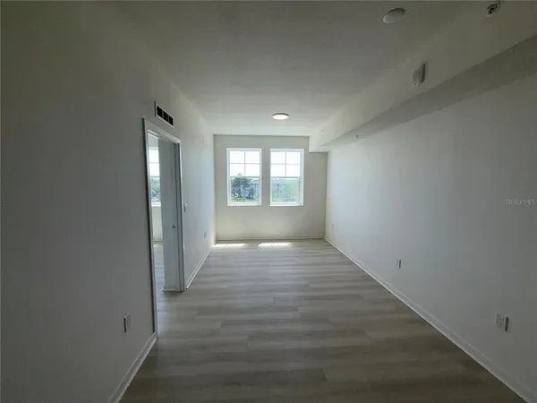 an empty room with windows