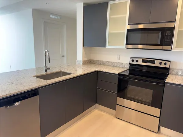 a kitchen with a stove and a microwave