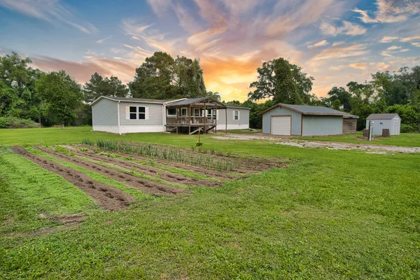 a house view with a garden space