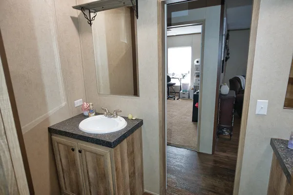 a bathroom with a sink and a mirror