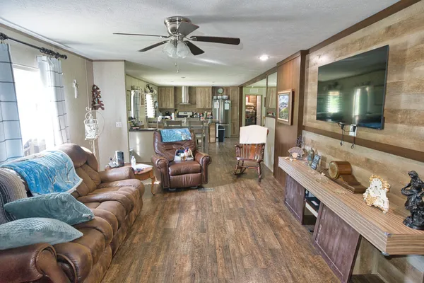 a living room with furniture and a large window
