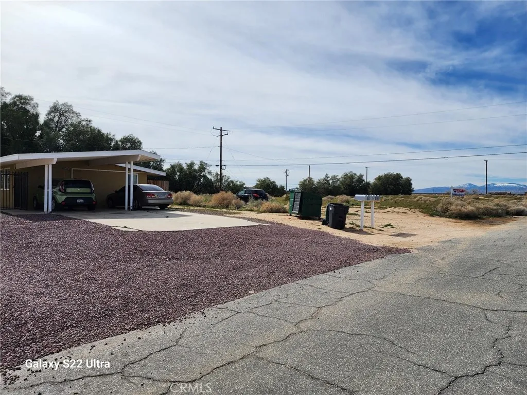 0 Peach Avenue Edwards, CA 93523 - Photo 8 of 8 a view of a dry yard with large trees