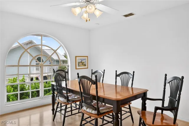 a view of a dining room with furniture window and outside view