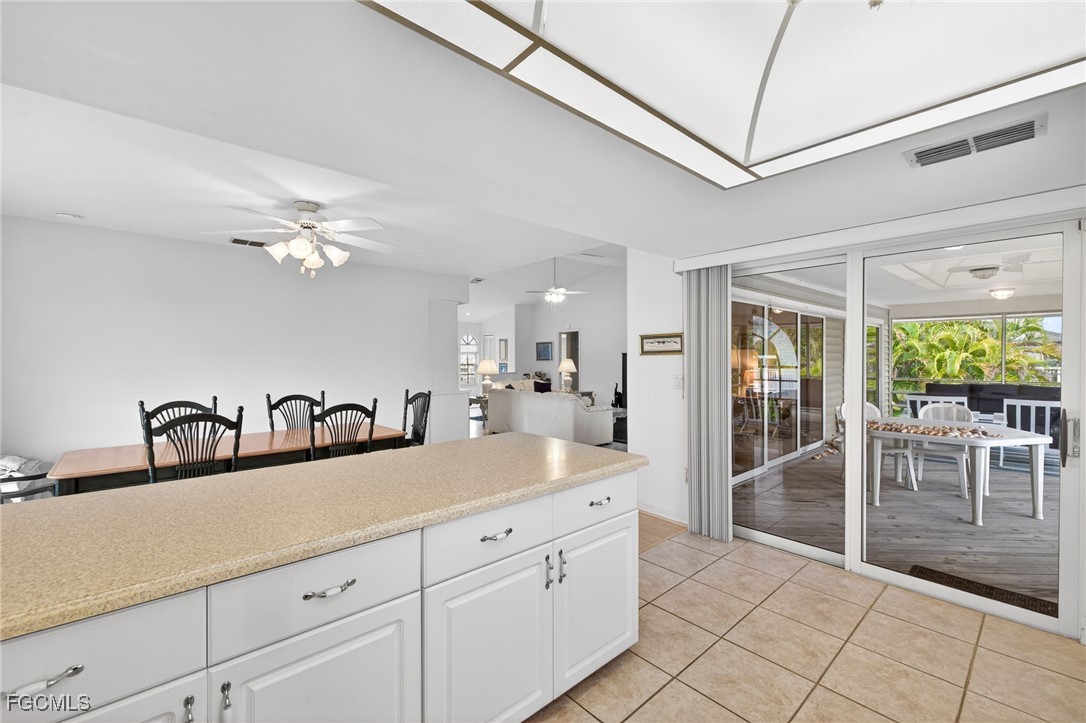 966 Sand Castle Road Sanibel, FL 33957 - Photo 14 of 39 a spacious bathroom with a double vanity sink and a mirror